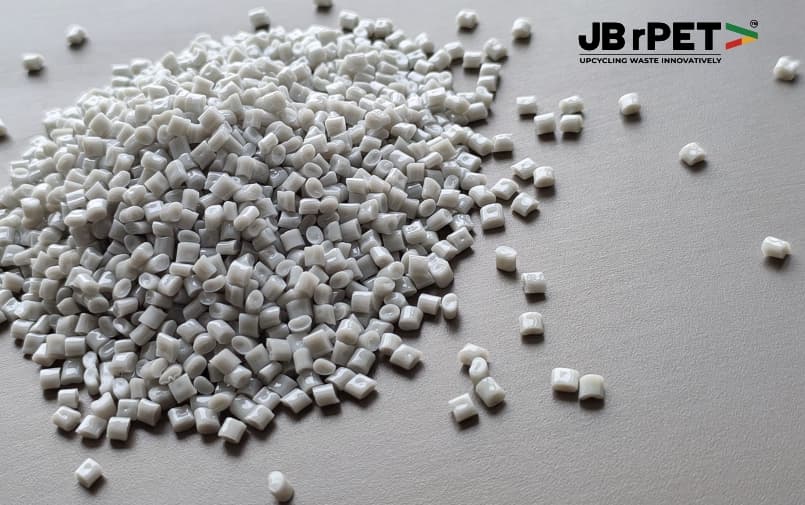 Close-up of white recycled PET resin granules by JB rPET